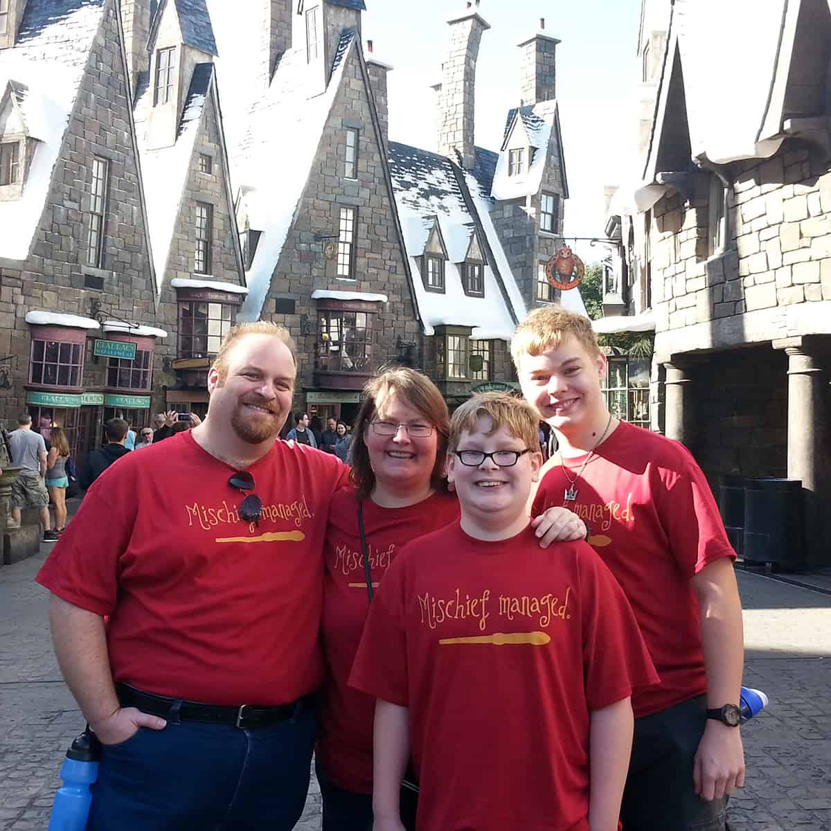My family in Hogsmeade at The Wizarding World of Harry Potter in Florida.